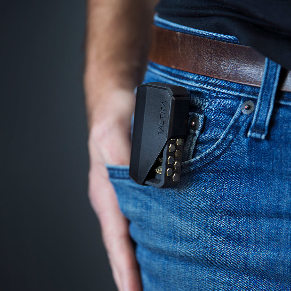 close up of the m250 hex screwdriver multitool clipped onto a person's belt